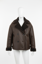 Bruine leren jas met bont op paspop