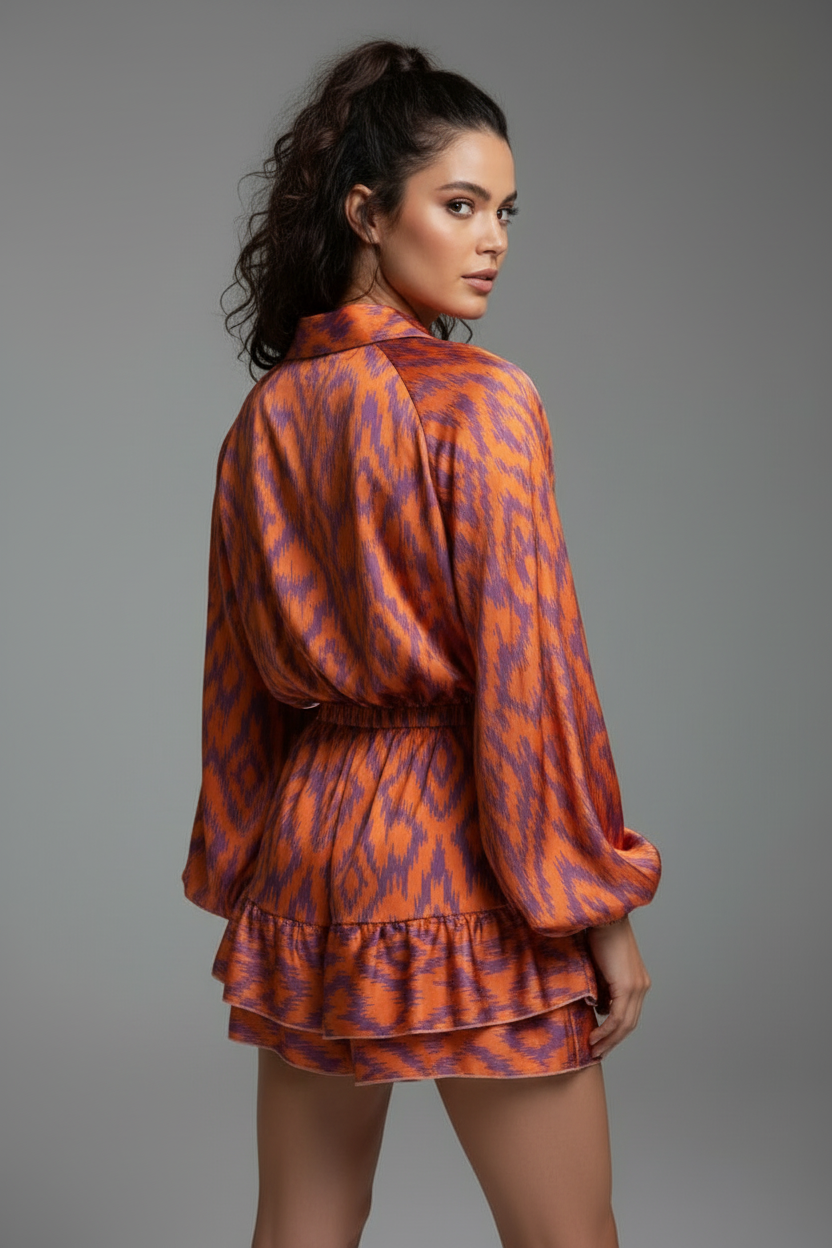 Orange and purple zigzag print romper back angle